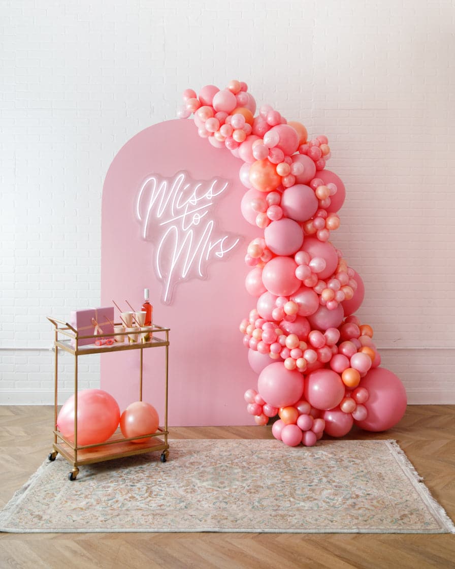 Rosé Bubbles – The Aadi Panel with Garland and Neon Sign | Rental