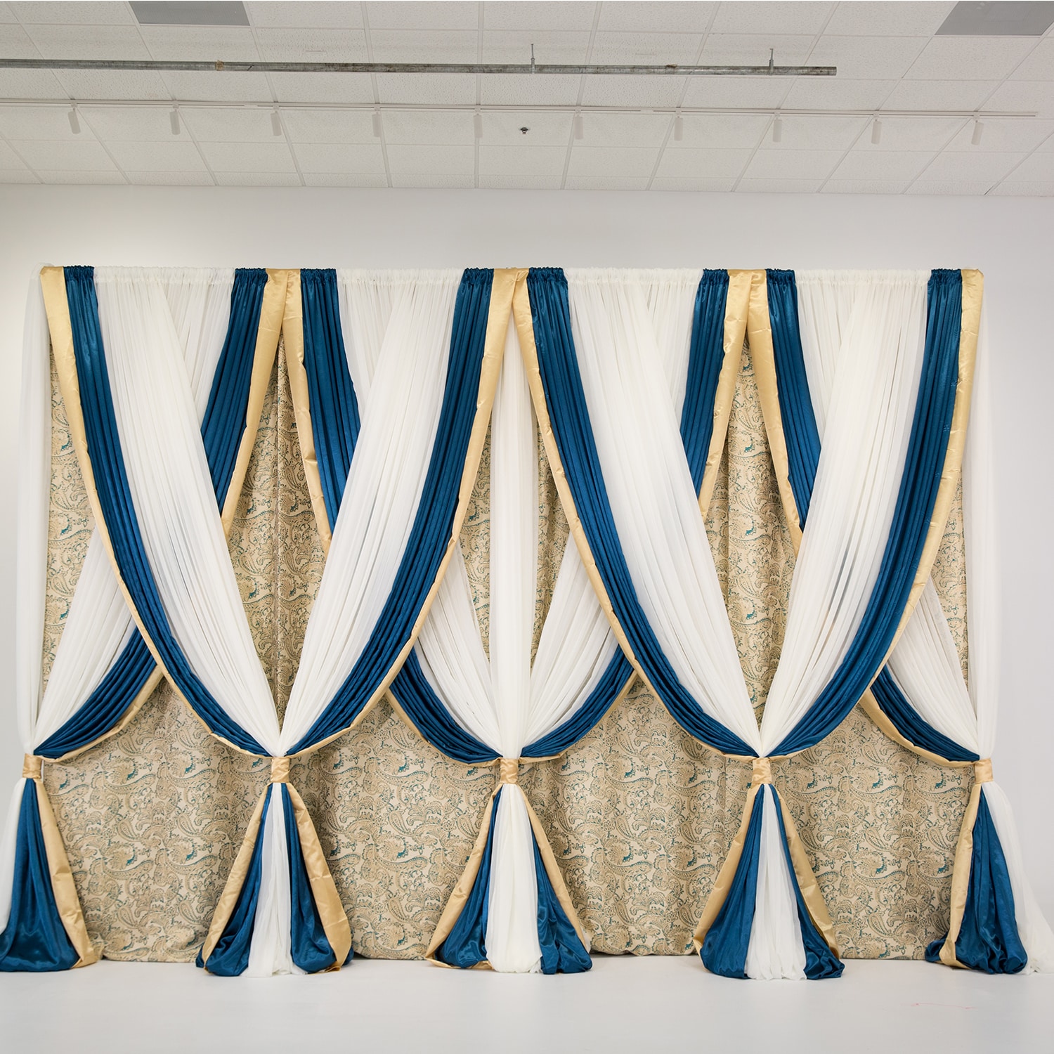 Drapery – Package – 14’H x 16’W Martinique Gold & Teal Backdrop | Rental
